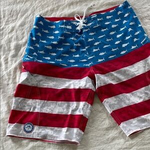 Pelagic Red,White, and Blue Board Shorts